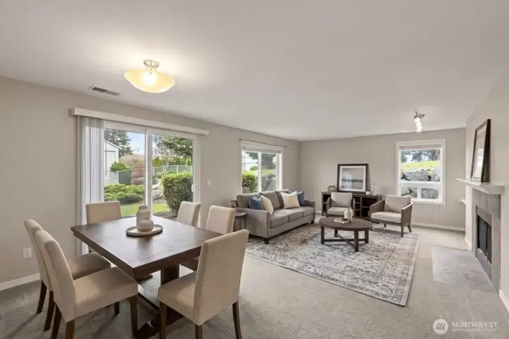 Dining and living area from different viewpoint. Patio and storage area are just outside the sliding doors. *Room is digitally staged to give you design inspiration!