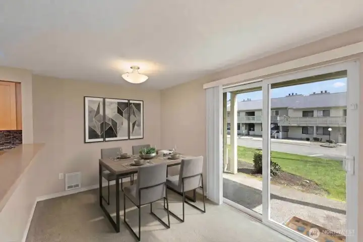 Dining area: private patio and storage unit located to the left of the patio. *Room is digitally staged to give you design inspiration!