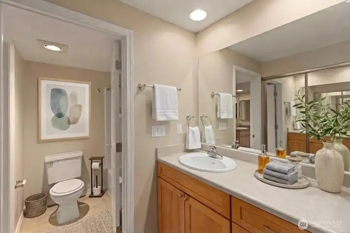 Full bath accessible from Primary bedroom or hallway. *Decor is digital.