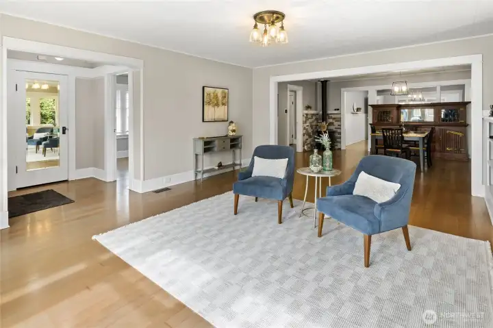 Front Entry and Living Room area, very open and lots of custom wood trim, tons of natural light too!