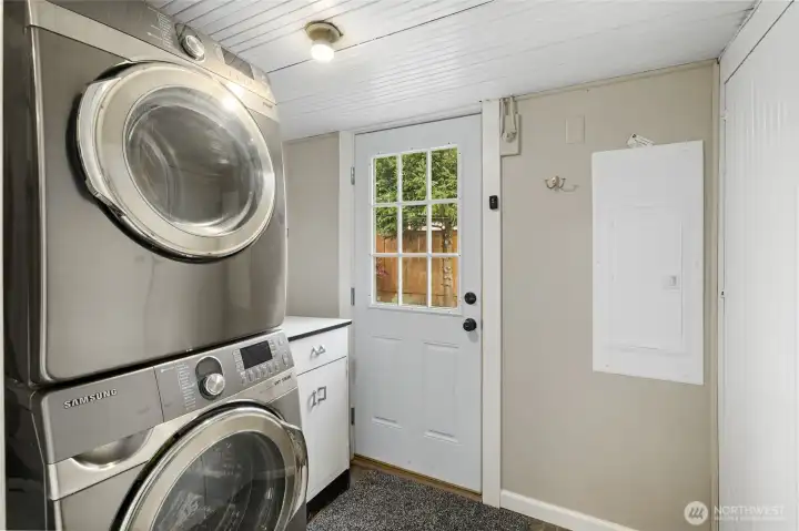 Laundry room/mudroom right off the kitchen and leading out to your backyard. New Washer/Dryer stay and brand new electrical with whole house surge protector.