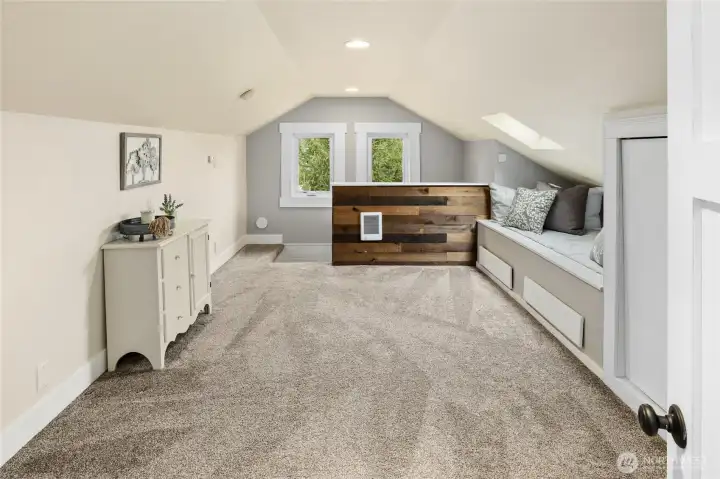 Your Loft Bedroom with built in bed, new windows, lighting, flooring and skylights with custom remote blinds.