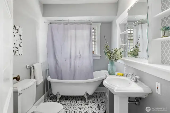 Guest Bathroom with GORGEOUS soaking tub and shower, open and light, extra built ins for storage.