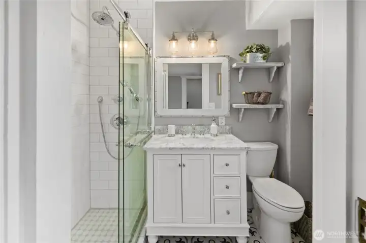 Primary Bathroom is all new and light and bright.