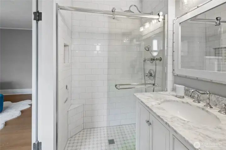 Gorgeous walk in shower in your primary bedroom.