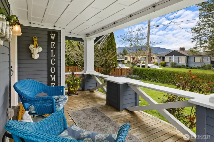 Plenty of sitting areas on your front porch. Love all the wood details on out here too.