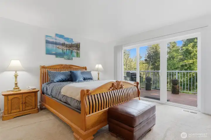 Primary bedroom with large sliders to the deck.