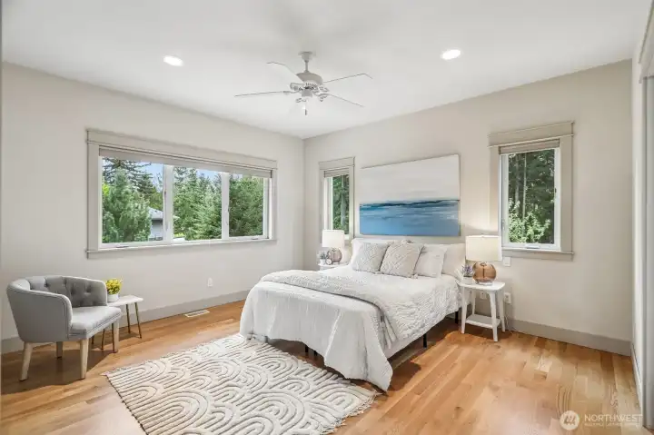 Check out this spacious light and airy master bedroom!  Tons of windows for abundance of natural light!