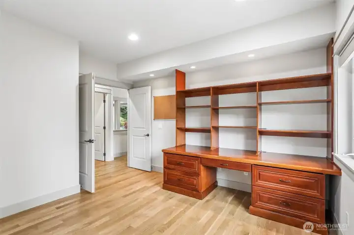 Seconary main floor bedroom with custom quality built ins!  Can be used as an office or a bedroom!  Quality construction throughout the home!