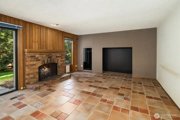 Living room with another wood burning fireplace.