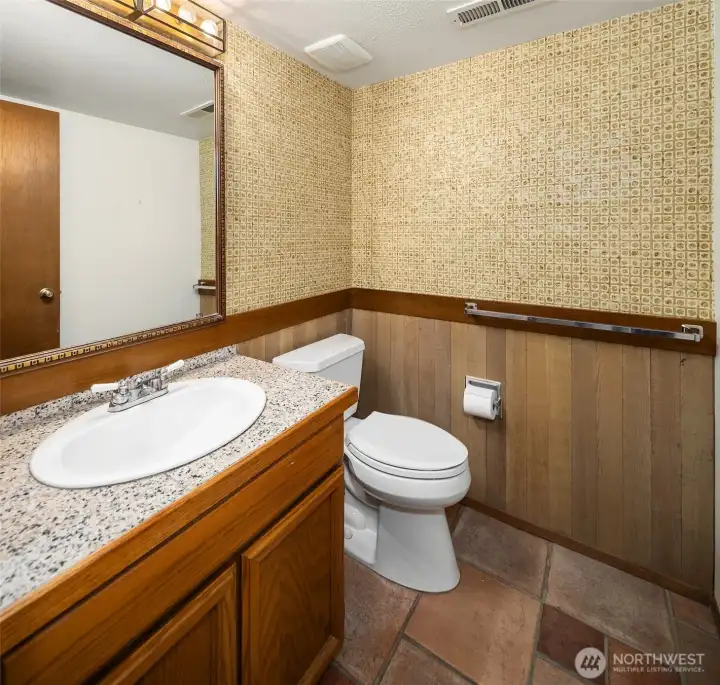 Convenient half bath located on the lower level.