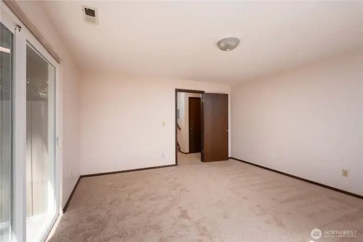 Door to lower level rec room. To the right is the door to the garage.