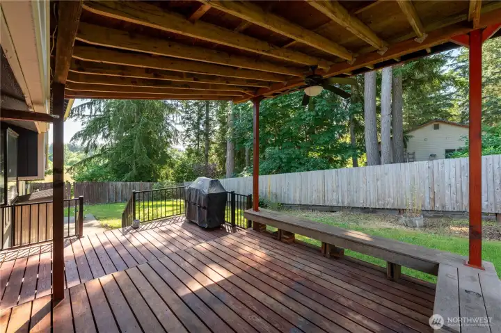 Covered deck with bench seating! Perfect for grilling out.