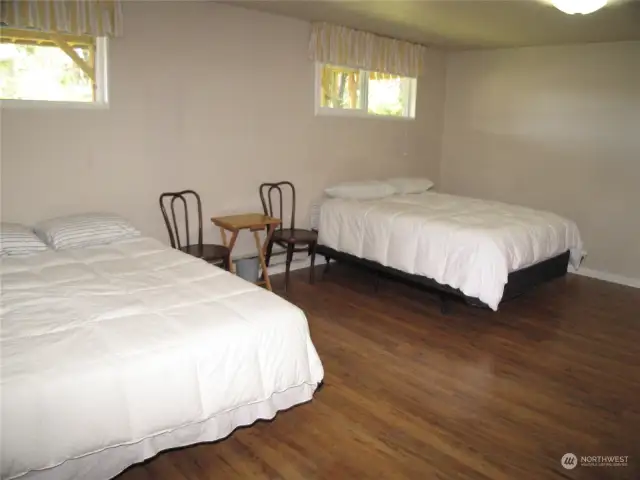 Bottom Floor has a huge room that could have many uses. At this time it is set up for guests.