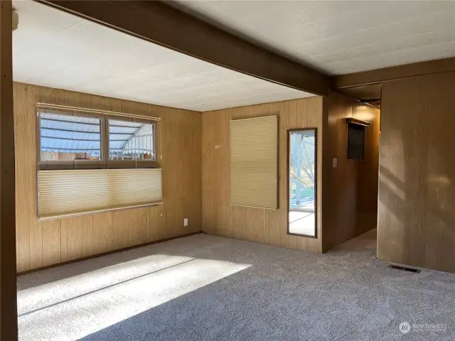 Living Room Space with brand new carpet and Hunter Douglas window coverings