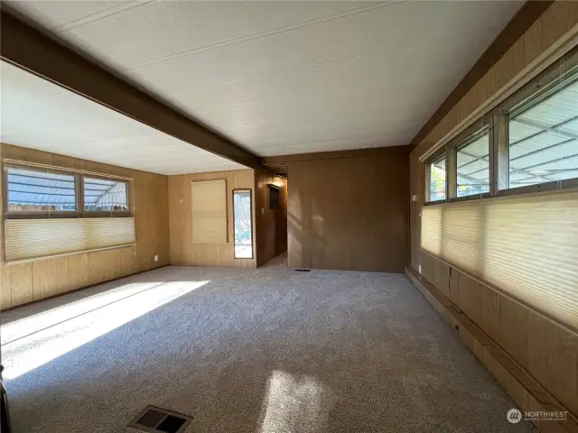 Living Room Space with brand new carpet and Hunter Douglas window coverings