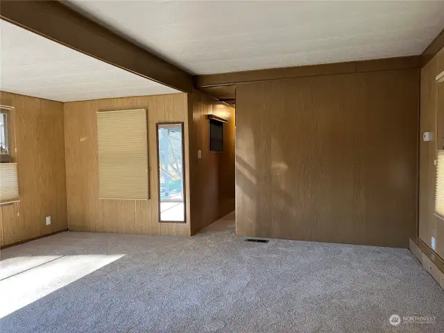 Living Room Space with brand new carpet and Hunter Douglas window coverings