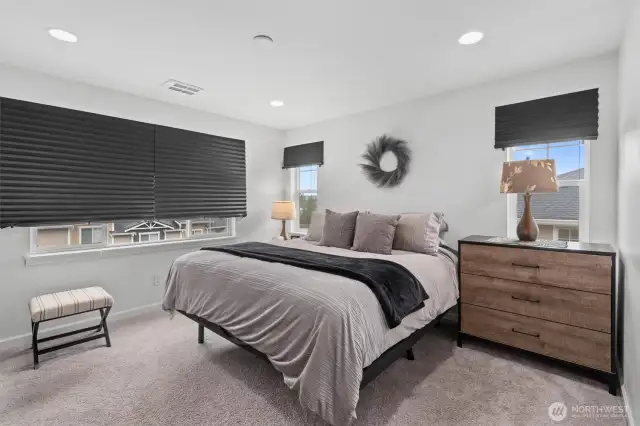 Large Primary Bedroom with ensuite bath and walk in closet with built-in organizer