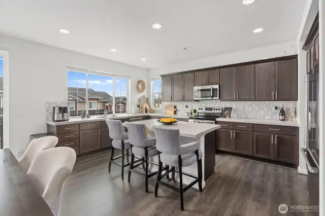 Stylish and spacious kitchen with island and stainless steel appliances