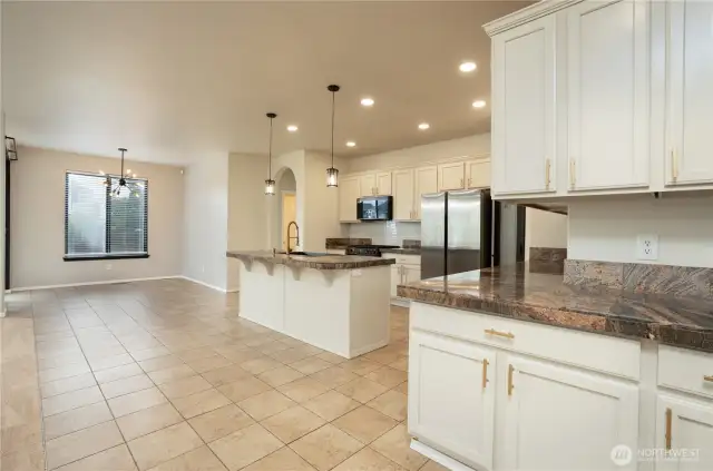 Large kitchen with tons of cabinet space with a huge island.