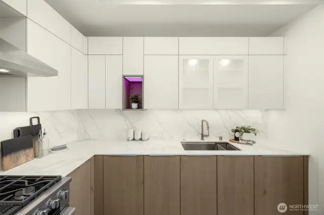 Chefs kitchen features Miele appliances, herb light, Smart Glass cabinetry. All tucked back for a clean aesthetic.