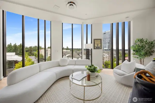 Floor-to-ceiling windows with vaulted ceilings.