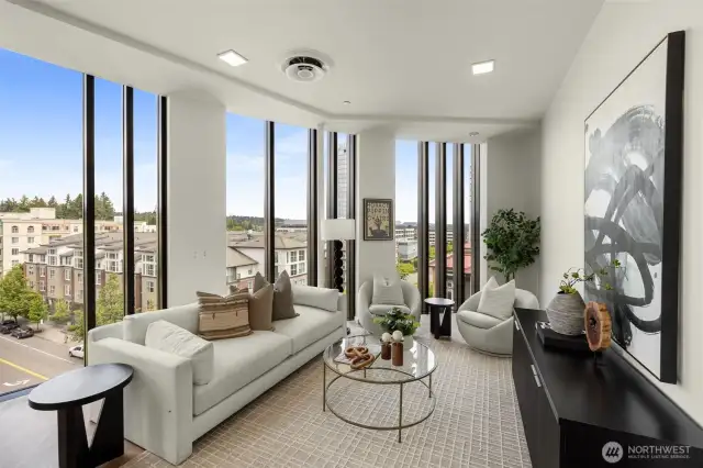 Floor-to-ceiling windows with vaulted ceilings.