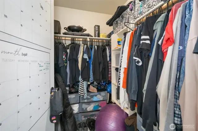 Primary bedroom walk-in closet