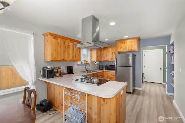 Open concept living space with breakfast bar.
