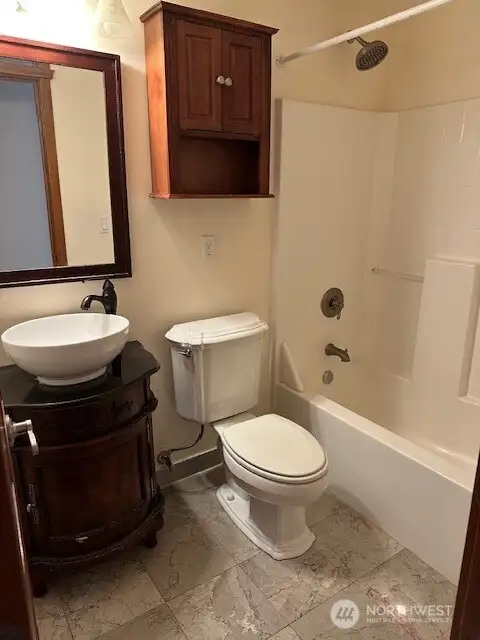 Up one level from the main living area is one full bath and two bedrooms. And the laundry.
