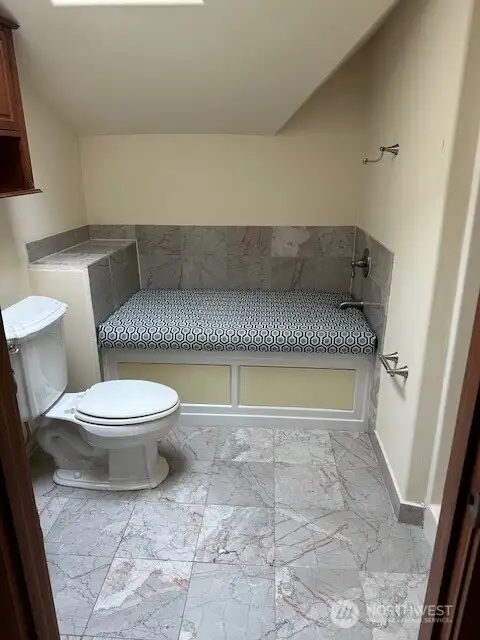 Tub area has a convertible seat. cushion cover.