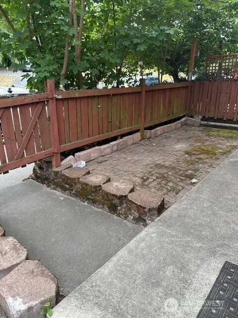 Large patio area at the entry! Great for potted plants, BBQ, guests visiting area!