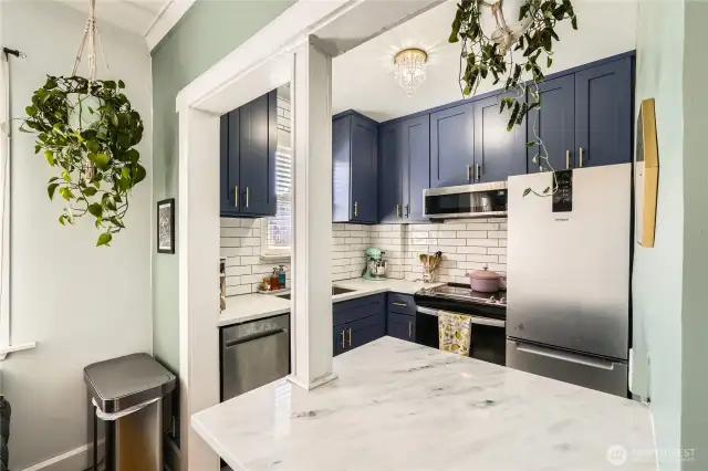 Charming kitchen with designer finishes and more.