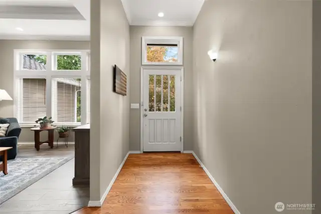 Entry with refinished hardwoods and abundant natural light.