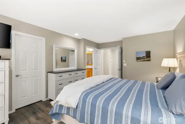Primary bedroom provides a walk in closet and updated bathroom.