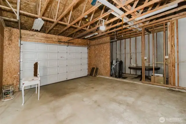 Expansive garage with room for projects or extra storage.