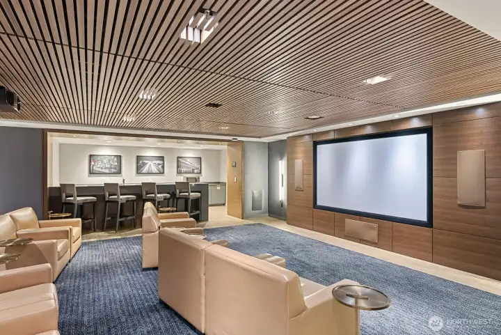 Host movie nights in the expansive screening room, complete with kitchen and bar area—easy to reserve for private use.