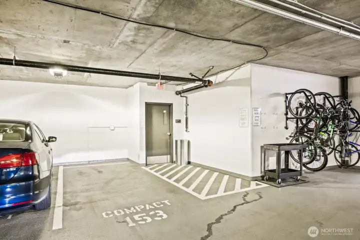 Covered parking space (#153S) in the garage—conveniently located on the same floor as the unit and right next to the lobby entrance.