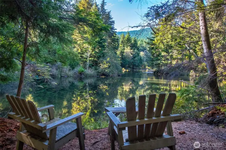 Peaceful lakeside seating area just minutes’ hike from the property.