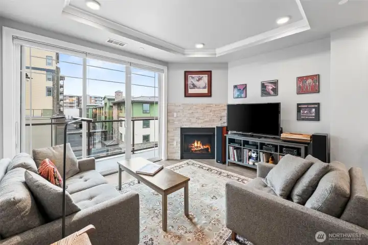 Bright, spacious living room with large windows and high ceilings