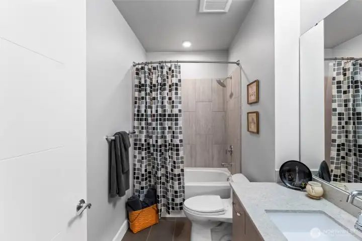 The main bath has a deep tub and tile surround. Both toilets in the condo are elongated, high-boy with soft closing lids... NO SLAMMING LIDS!