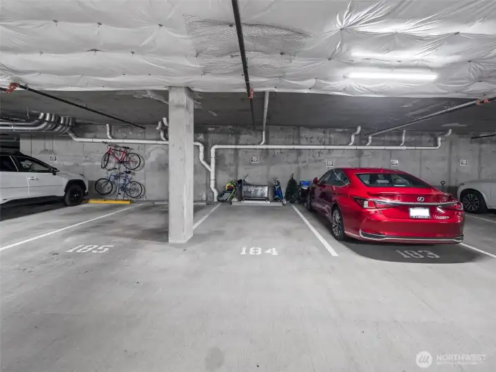 Two parking spaces are included...this one and a coveted EV parking space in a different part of the garage.