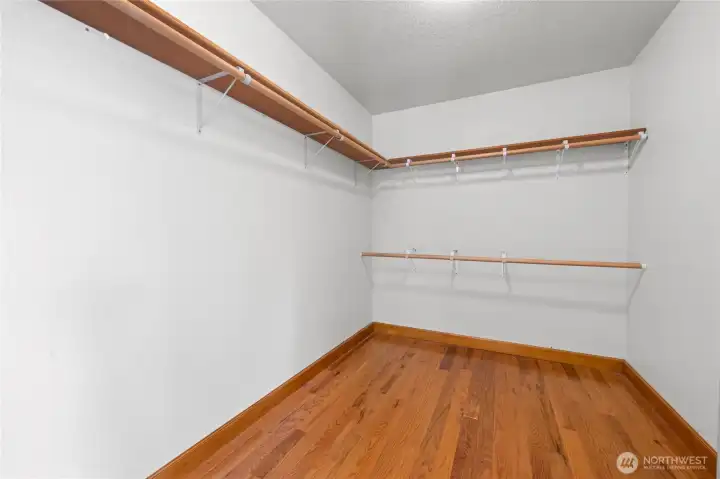 Primary bedroom walk in closet