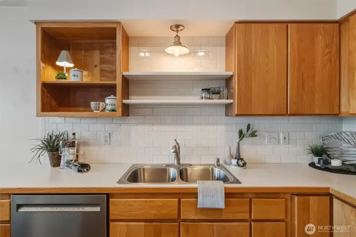 The subway tile backsplash defines the kitchen very well and gives it a "clean" look.
