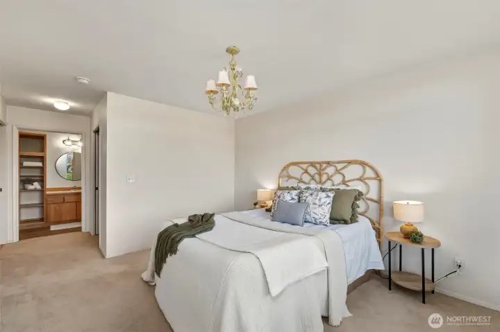 Looking toward the primary bath and walk-in closet.