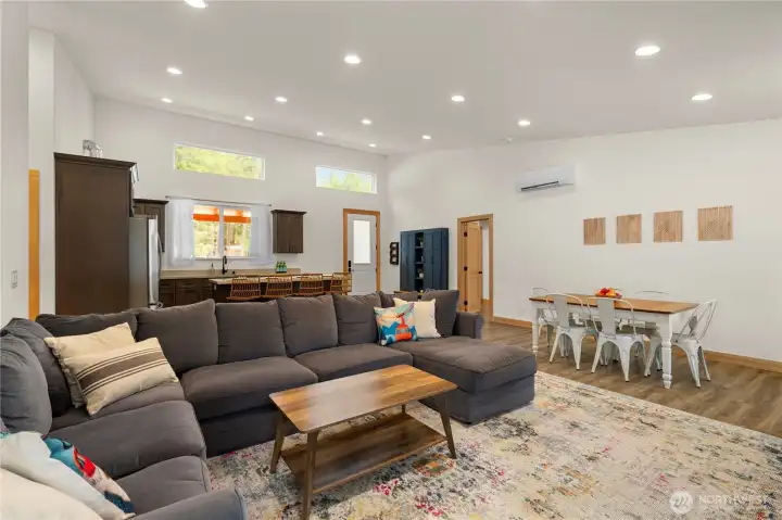 Spacious great room featuring 15-foot vaulted ceilings and abundant natural light.