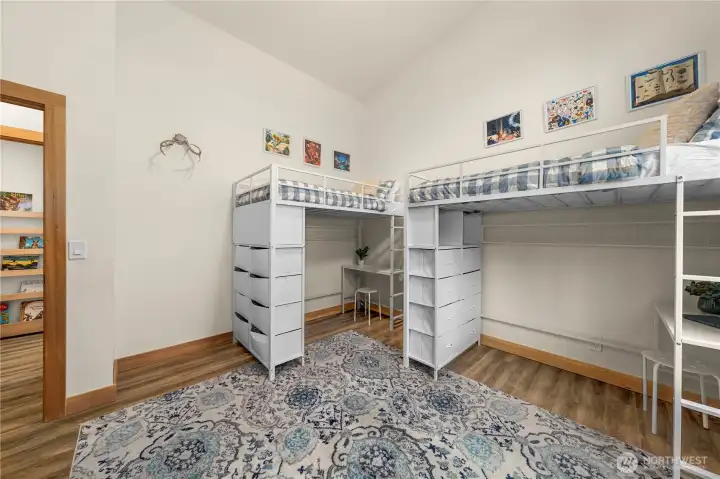 Bedroom 3 features a soaring 15' vaulted ceiling, full-size closet, and abundant natural light.