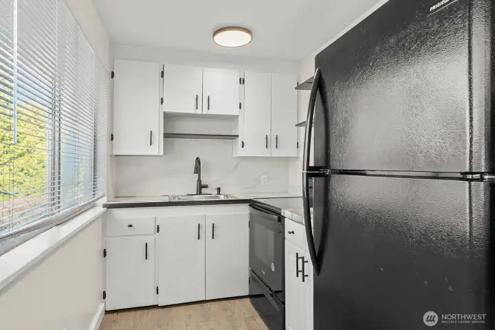 Unit 2 - 2 beds, 1 bath. Newer LVP flooring, paint, light fixtures, and appliances.