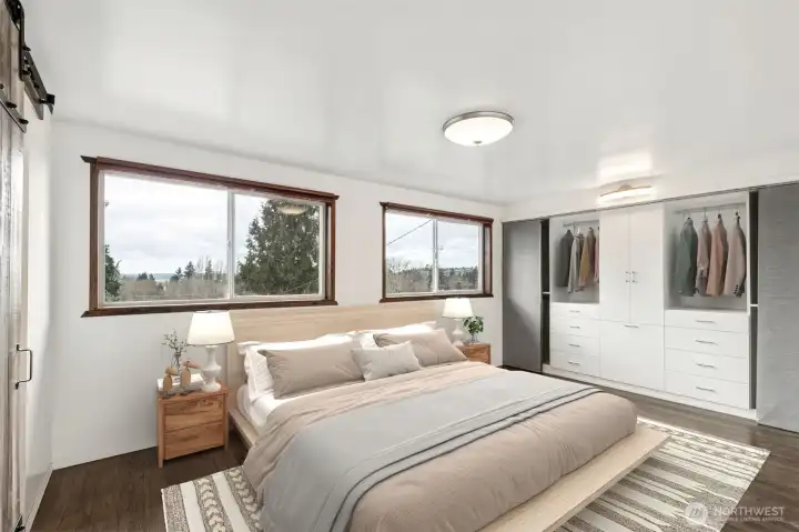 Primary Suite: Spacious primary suite on the main floor, thoughtfully updated for comfort and maximum natural light.