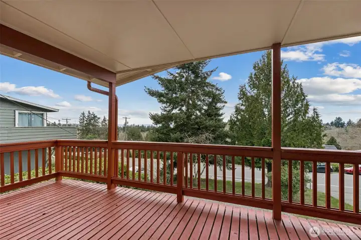 Large wrap-around entertainment deck with views of Puget Sound and the Olympic Mountains in Des Moines, WA.